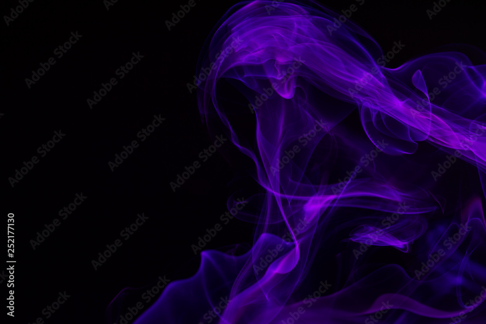 Colorful smoke close-up on a black background Colorful smoke close-up on a black background