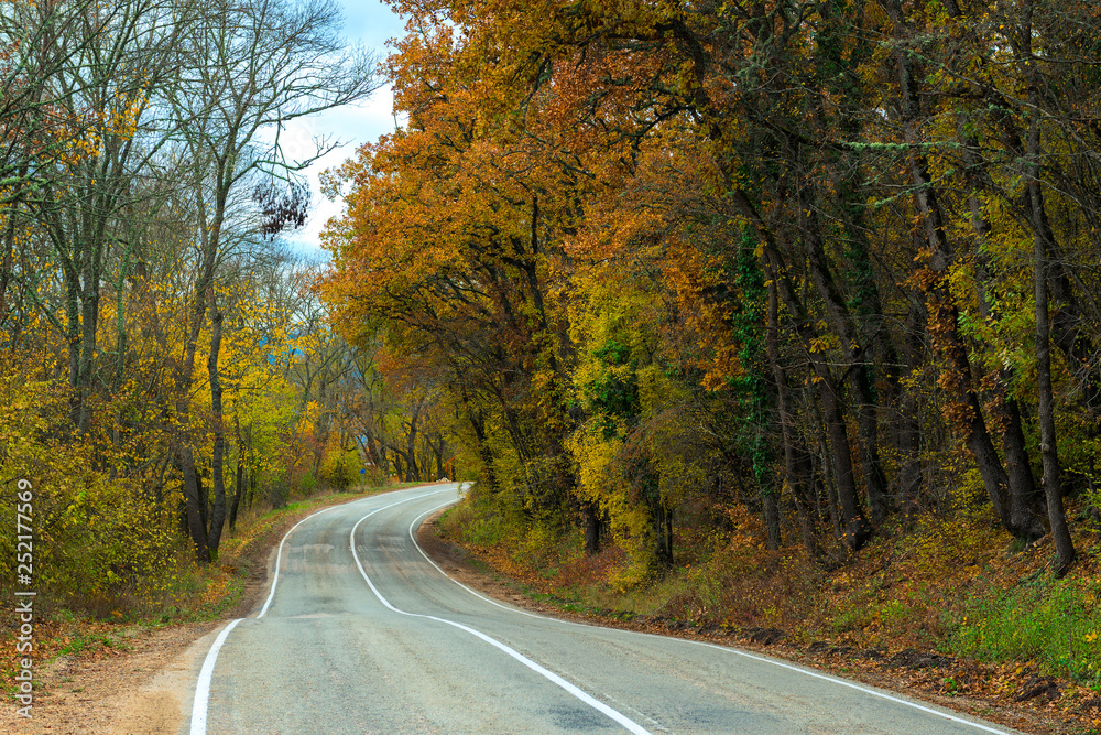 Car winding road in the mountains on an autumn afternoon Car winding road in the mountains on an autumn afternoon