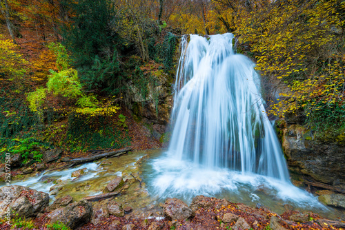 Fast full-flowing waterfall Jur-Jur in the mountains of Crimea  a picturesque natural landmark in the fall  Russia