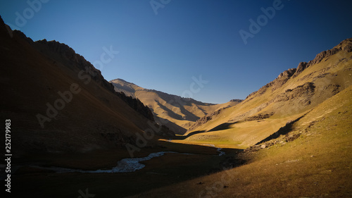 Sunset view to Tash-Rabat river and valley in Naryn province, Kyrgyzstan