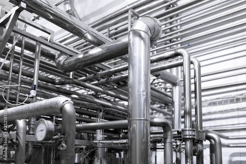 Steel water pipeline, chrome pipes , pipe lines and other equipment tool in plant workshop Steel water pipeline, chrome pipes , pipe lines and other equipment tool in plant workshop