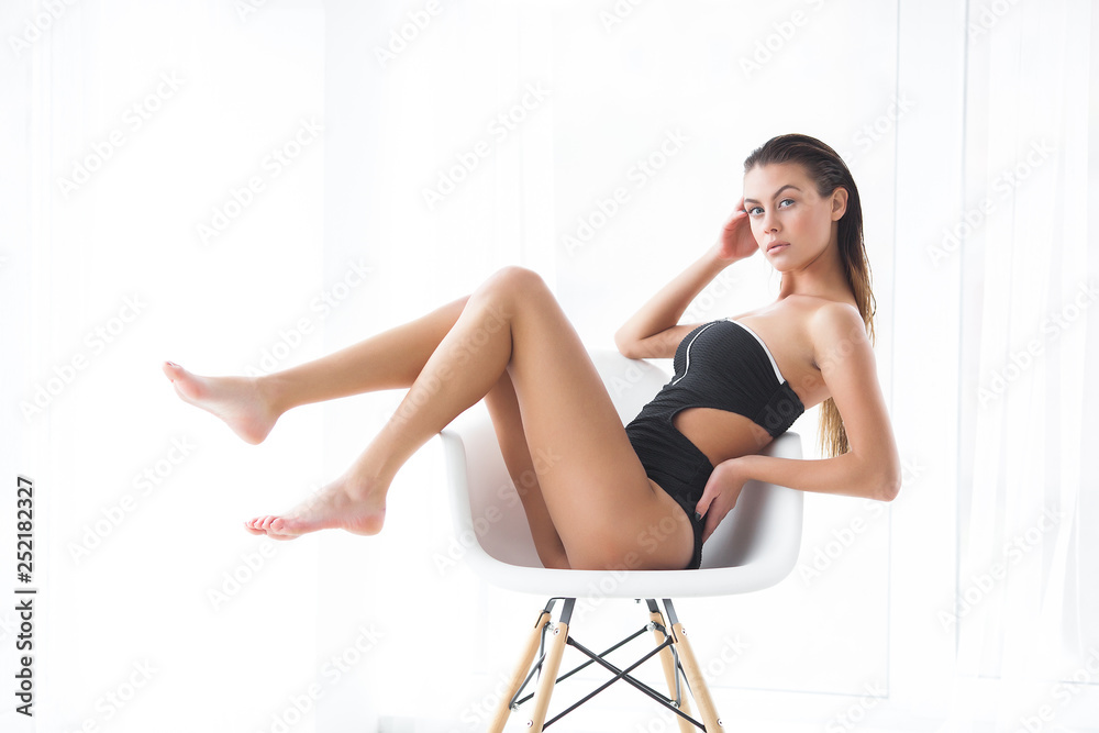 Beautiful woman spa. Charming beauty indoors. Luxury lady relaxing. Blond female on neutral background.