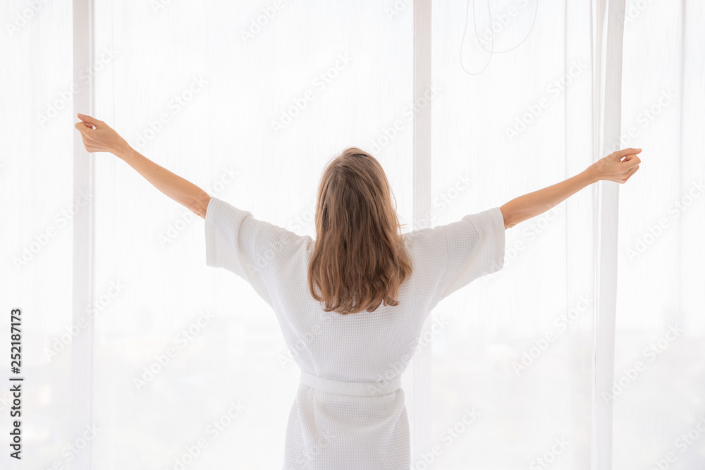pregnancy, motherhood, people and expectation concept - close up of happy pregnant woman opening window curtains. pregnancy, motherhood, people and expectation concept - close up of happy pregnant woman opening window curtains.