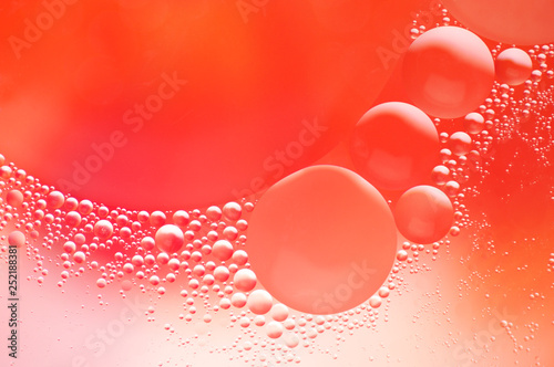 Coral colored abstract background with bubbles