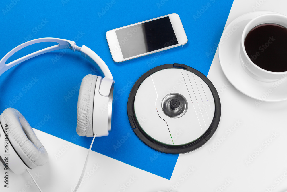 Stylish headphones on blue and white color background, top view. - obrazy, fototapety, plakaty 