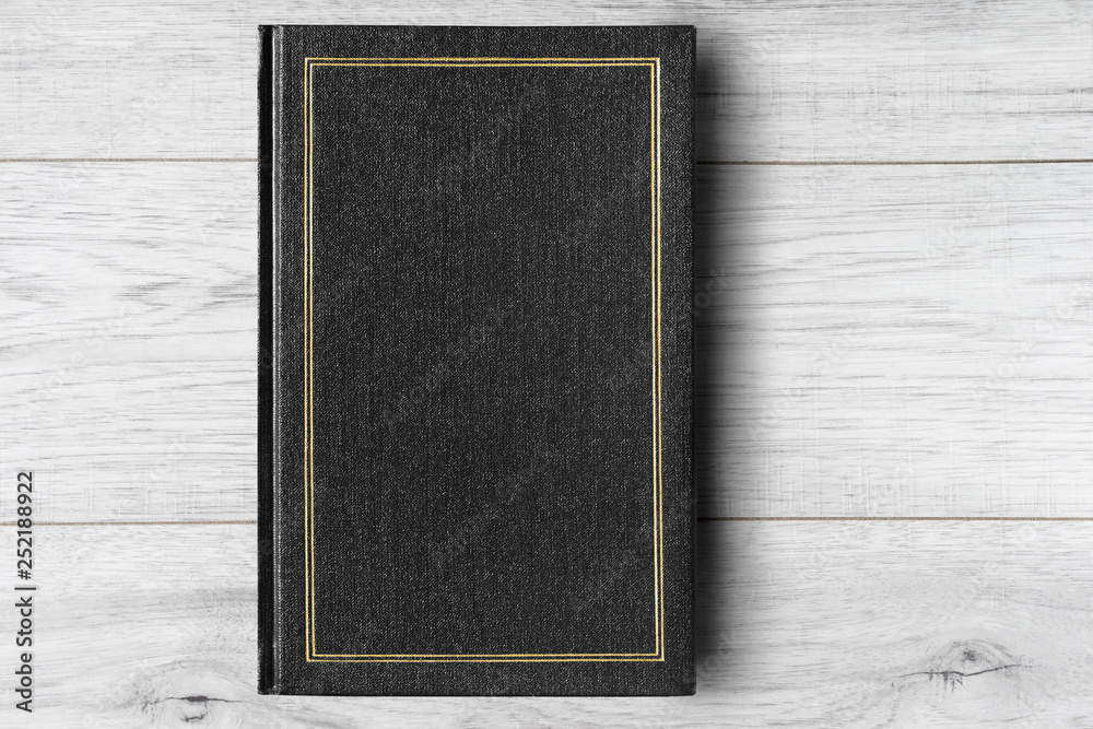Fototapeta premium Book on wooden background