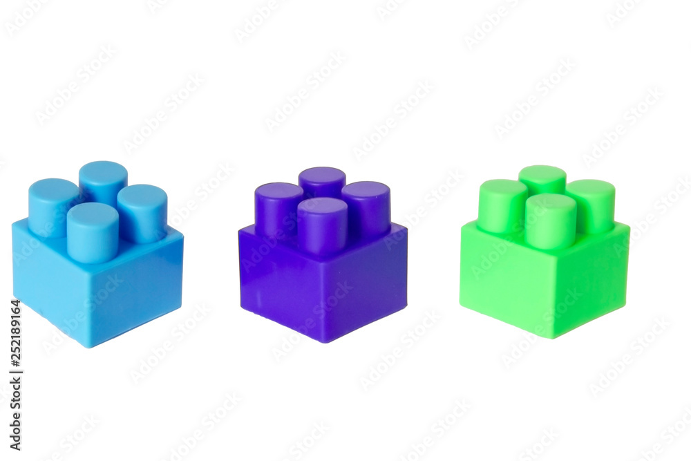 details of a children's plastic constructor on a white background. colored cubes. block. details of a children's plastic constructor on a white background. colored cubes. block.