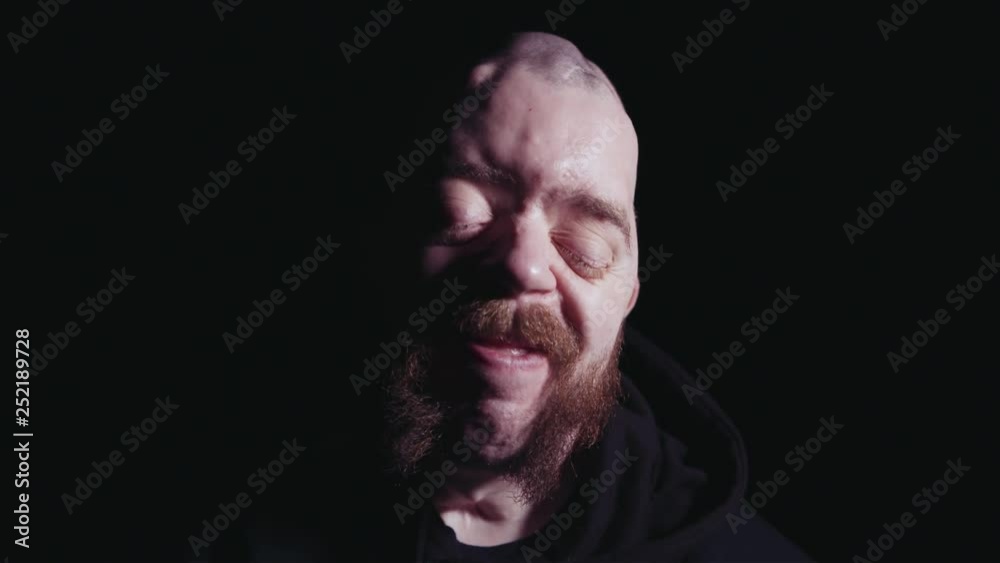 Smiling laughing man with genetic disorder, studio portrait Smiling laughing man with genetic disorder, studio portrait