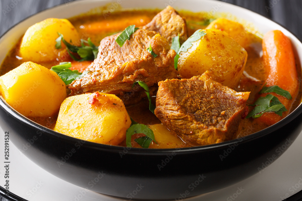 Namibia Potjiekos traditional lamb dish with vegetables close-up in a bowl. horizontal Namibia Potjiekos traditional lamb dish with vegetables close-up in a bowl. horizontal