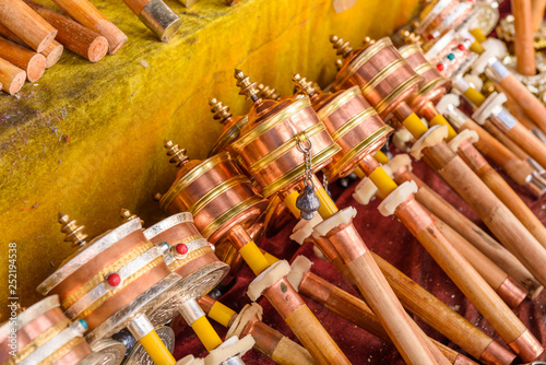 Mani wheels (hand prayer wheels) in Jokhang temple, Lhasa, Tibet, China. photo