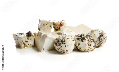 Assortment of tasty cheese with spices on white background