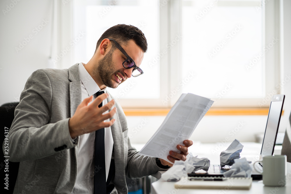 Fototapeta premium Young businessman is angry and frustrated.