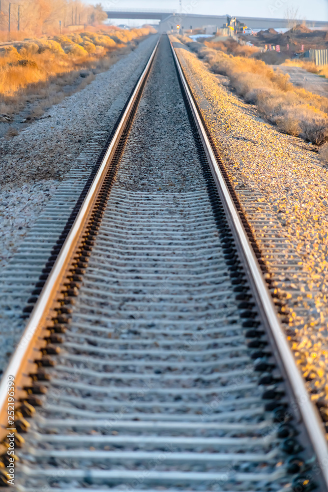 Fototapeta premium Railway track viewed on a bright sunny day