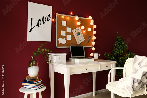 Stylish workplace with lapt...