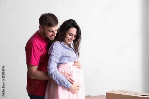Happy pregnant couple with ...