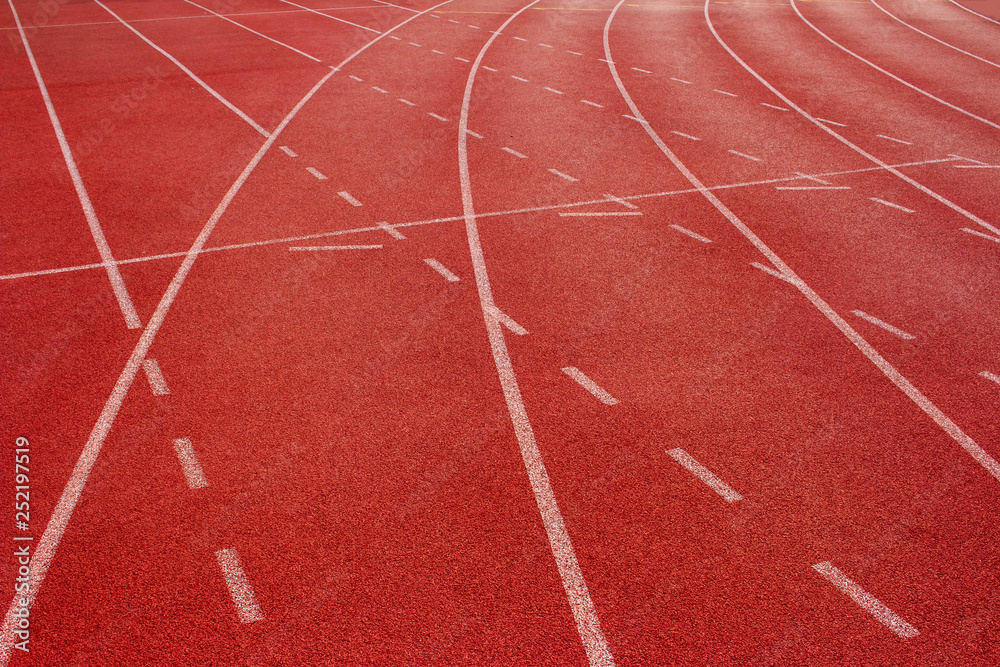 Fototapeta premium Red running track Synthetic rubber on the athletic stadium