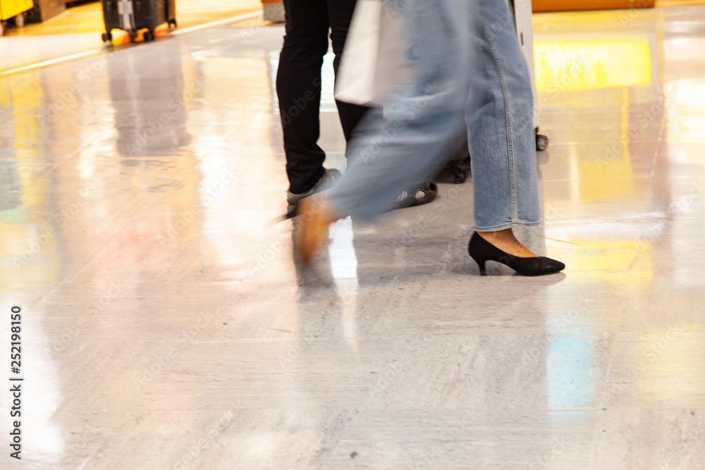 Business people walking in train station blur motion. Business people walking in train station blur motion.
