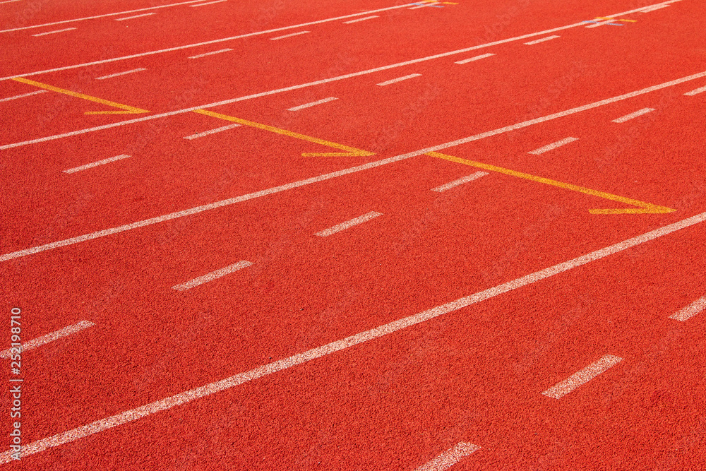 Fototapeta premium Red running track Synthetic rubber on the athletic stadium