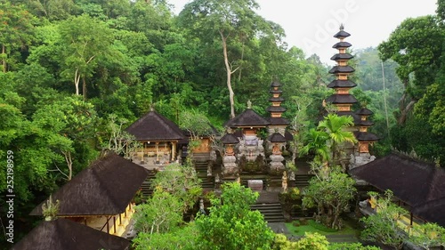 Buddhist Pura Gunung Lebah temple in Ubud tropical forest. Aerial drone 4k footage.