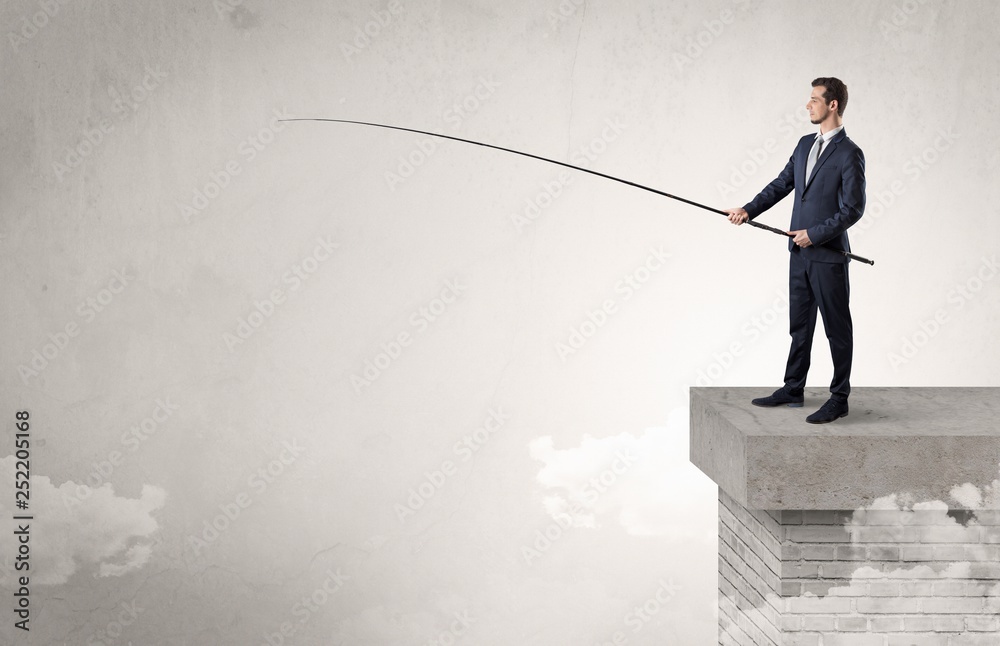 Businessman fishing nothing from the cloud with free copyspace Businessman fishing nothing from the cloud with free copyspace
