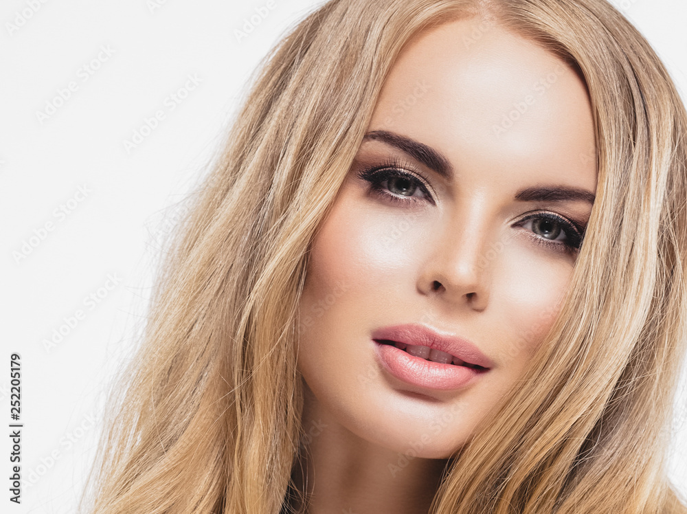 Beautiful woman blonde hair face close up portrait studio on white