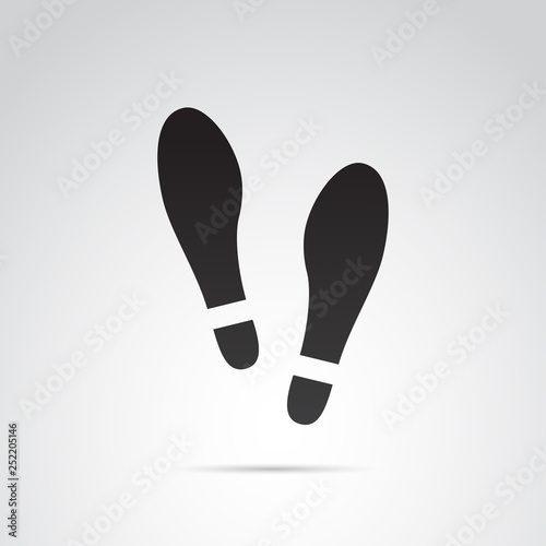 Human footprints in shoes vector icon.