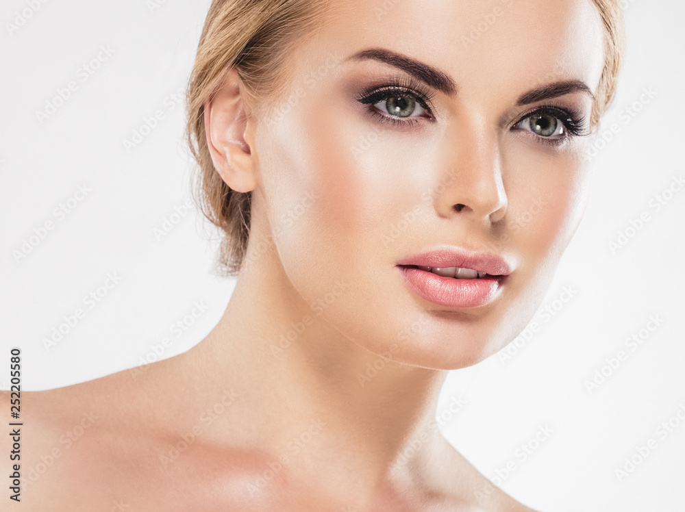 Beautiful woman blonde hair face close up portrait studio on white Beautiful woman blonde hair face close up portrait studio on white