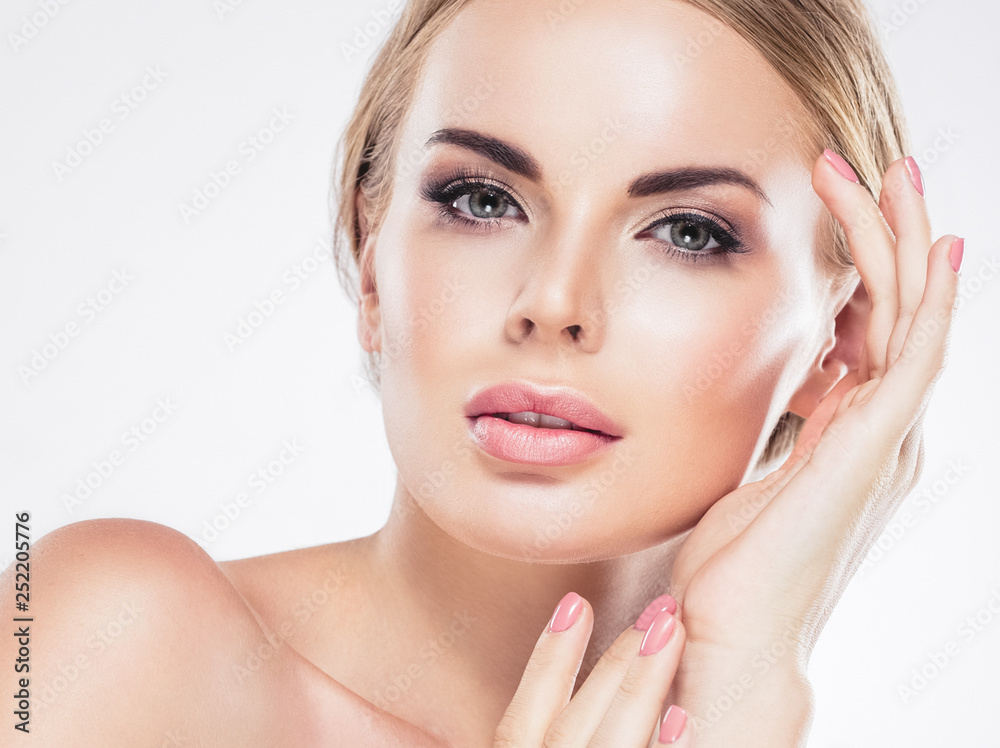 Beautiful woman blonde hair face close up portrait studio on white Beautiful woman blonde hair face close up portrait studio on white