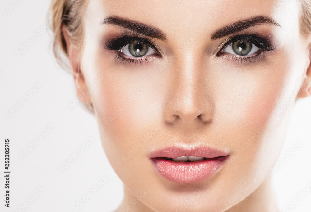 Beautiful woman blonde hair face close up portrait studio on white