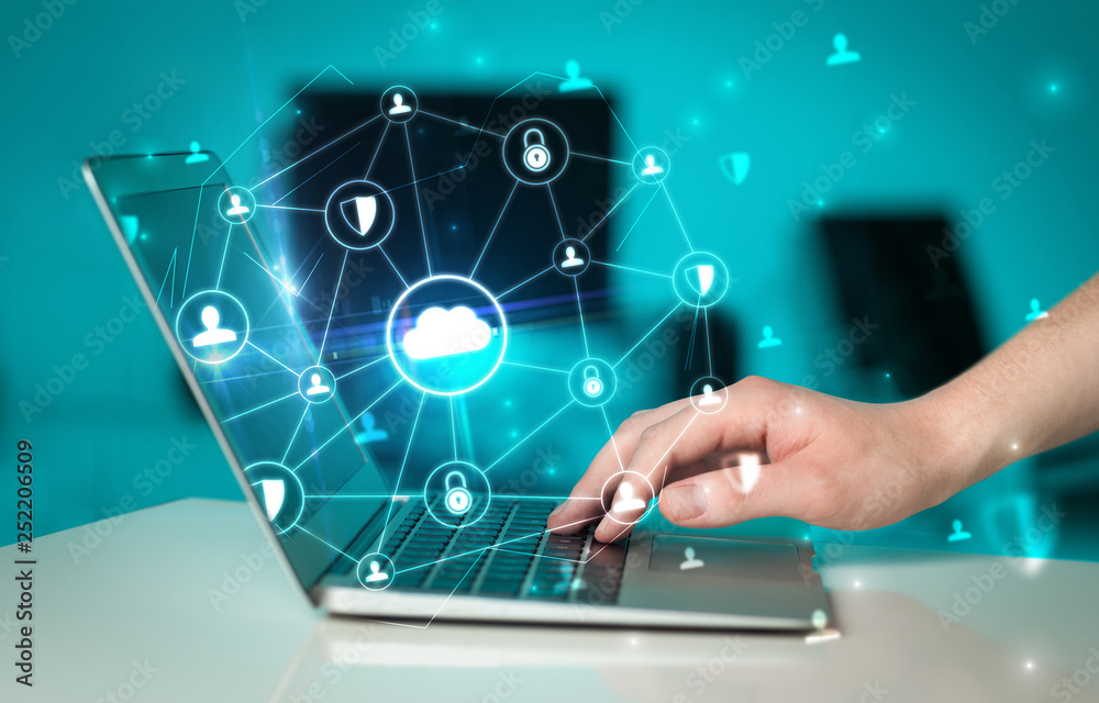Hand using laptop with centralized cloud computing system and network security concept
Hand using laptop with centralized cloud computing system and network security concept