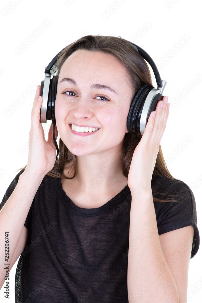 Joy and music studio portrait of happy young brunette woman with earphones is dancing and singing Joy and music studio portrait of happy young brunette woman with earphones is dancing and singing