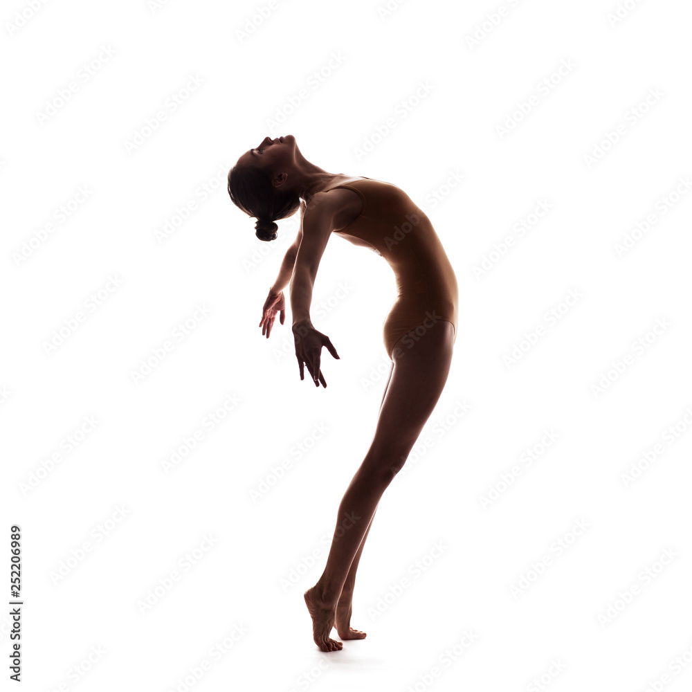 young beautiful dancer in beige swimsuit posing young beautiful dancer in beige swimsuit posing