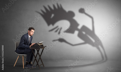 Man working hard and he is afraid of a yelling shadow
 photo