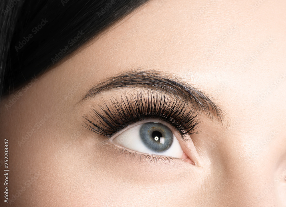 Fototapeta premium Eyes lashes woman closeup isolated on white macro