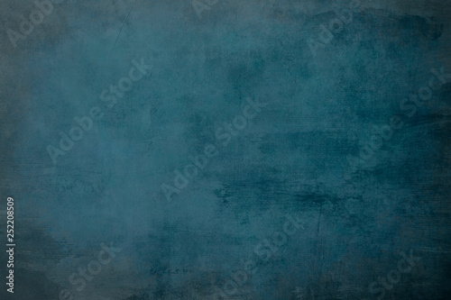 Dark blue grungy distressed canvas bacground