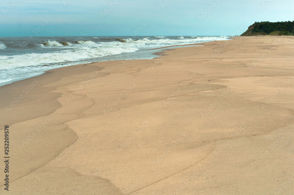 Sea coast. Waves and storms at sea. Waves on the Baltic Sea.