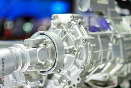 close up universal joint and transmission gearbox with drive shaft a fragment of modern car engine