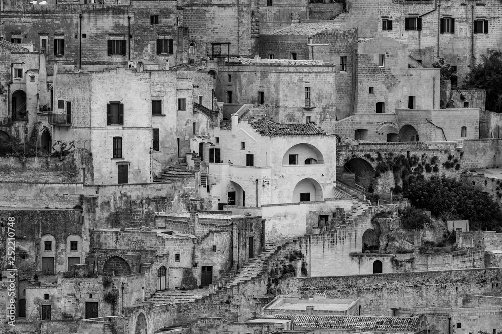 Amazing close-up black and white view of ancient town of Matera, the Sassi di Matera, Basilicata, Southern Italy, architectural details and buildings on many levels