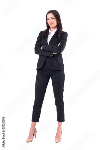 Confident successful independent strong business woman with crossed arms in elegant suit. Full body isolated on white background. 