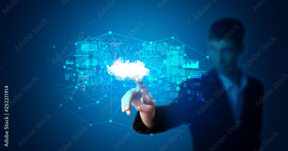 Man touching hologram projection displaying information from cloud based system
Man touching hologram projection displaying information from cloud based system