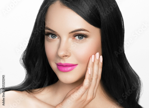 Brunette woman with long black hair and pink lipstick lips, female with beautiful eyes with lash extensions 