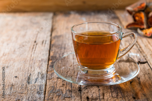 Bael tea juice on wooden table , healthy drink