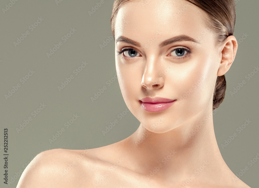 Healthy skin woman beautiful face close up over gray background Healthy skin woman beautiful face close up over gray background