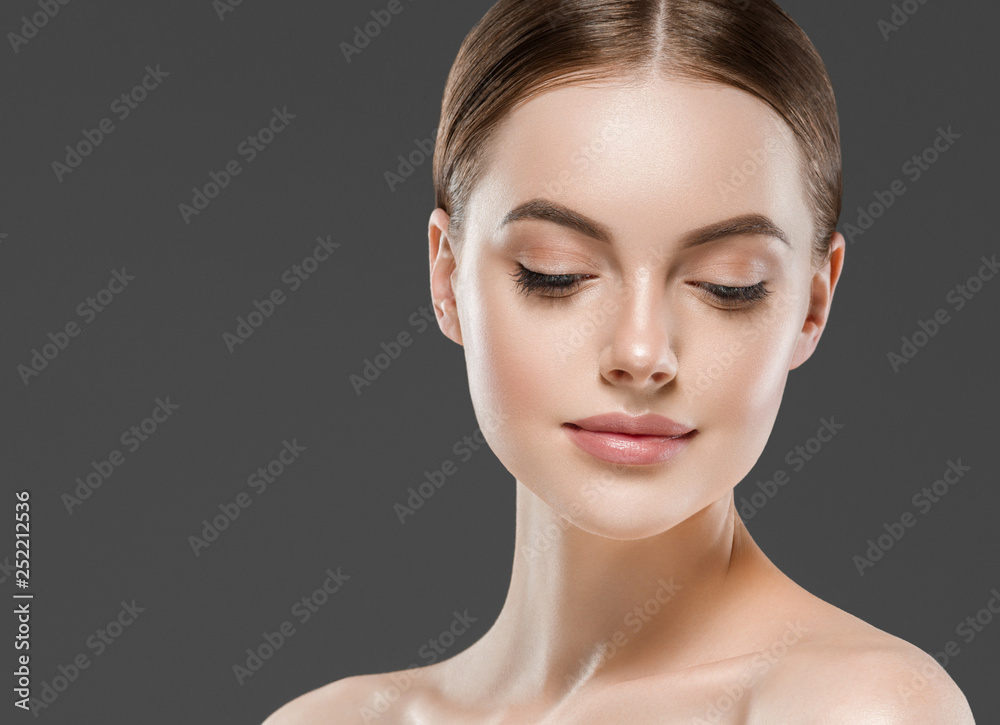 Healthy skin woman beautiful face close up over gray background Healthy skin woman beautiful face close up over gray background