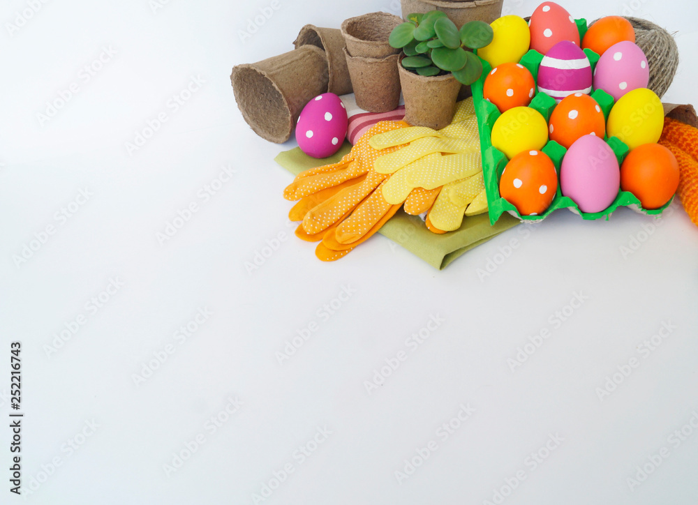 Decorative Easter composition. Birdhouse and Easter eggs. Flowerpots