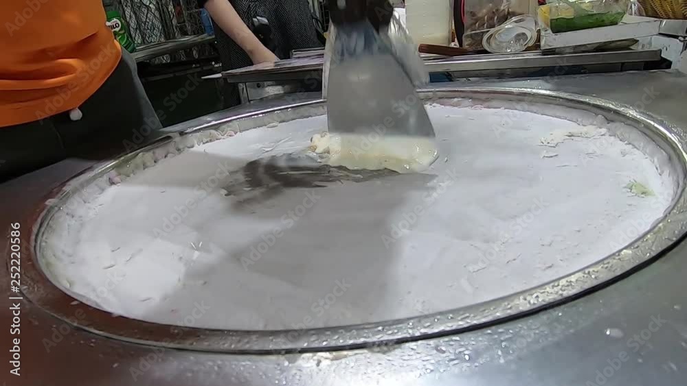 Making Ice Cream on food market in Vietnam. Making Ice Cream on food market in Vietnam.