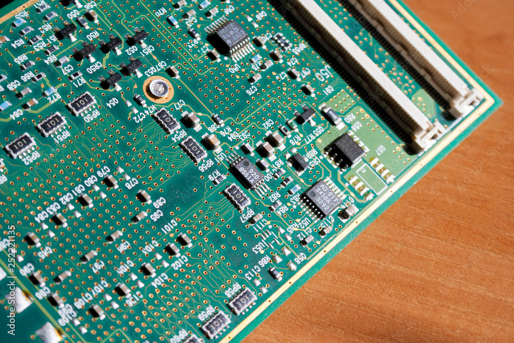 Close-up picture of green printed circuit board - PCB. Computer curcuit background.