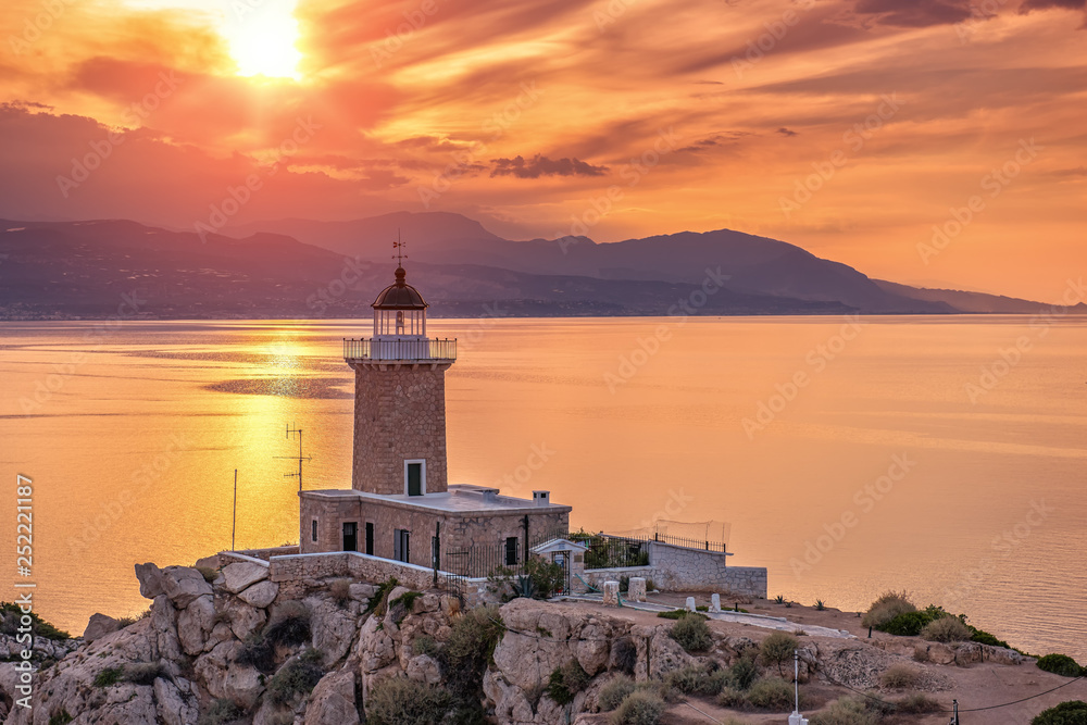 Beautiful sunset in the lighthouse in Melagavi cape at Loutraki, Greece.