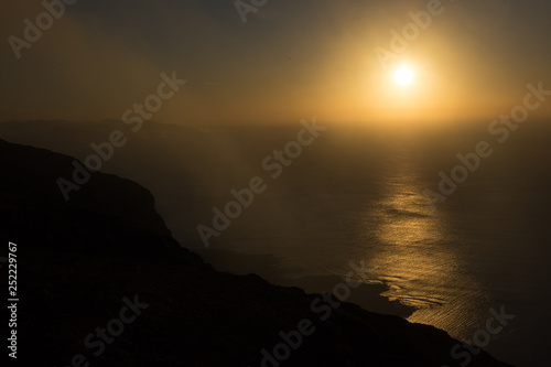 Panoramic view from the Mirador del Rio in Lanzarote during sunset with the island of La Graciosa