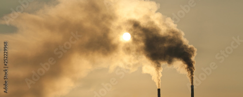 Air pollution. Smokestacks making air pollution over dramatic sky